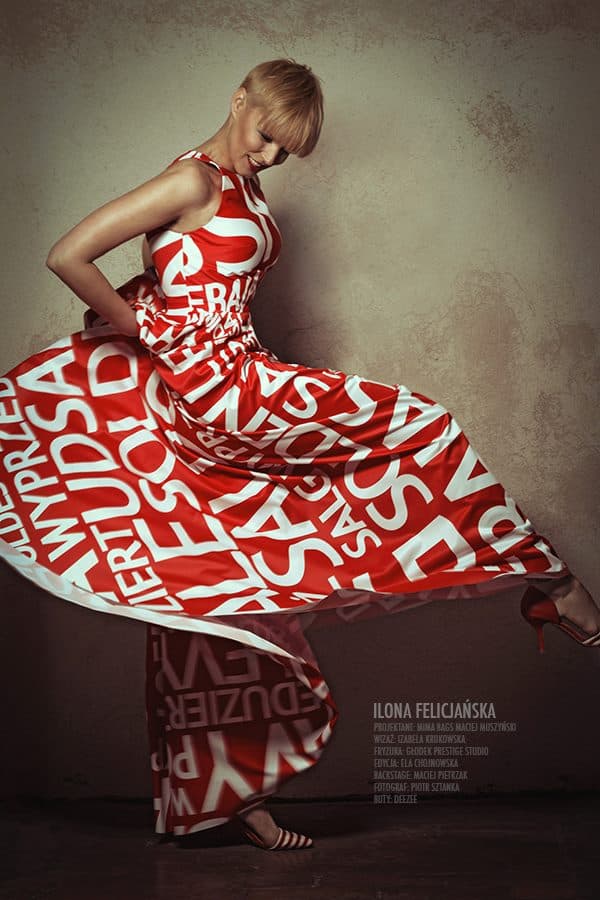 Modelka w czerwonej sukni i makijaż glamour z czerwonymi ustami w sesji do magazynu Gala.